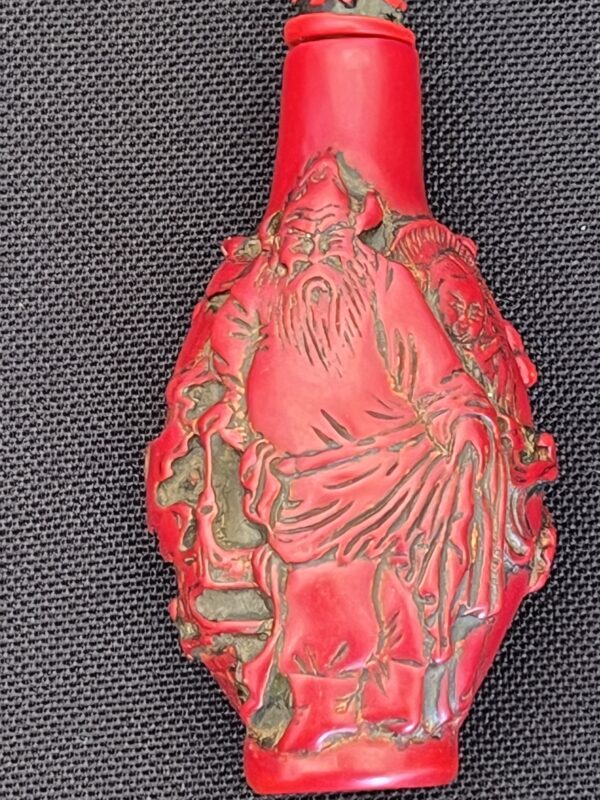 Exquisite Red Carved Snuff Bottle with Sage Design
