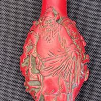 Exquisite Red Carved Snuff Bottle with Sage Design - Image 2